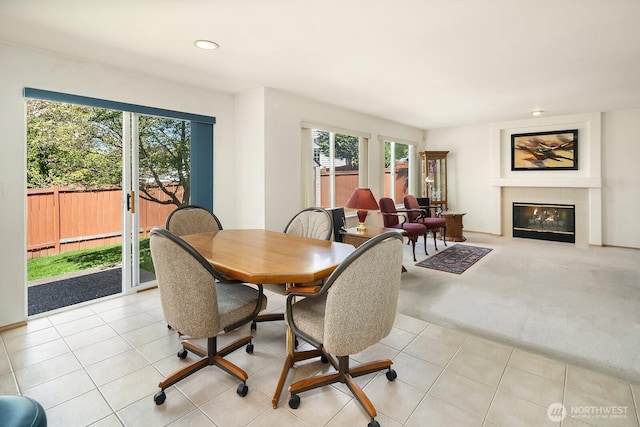 19021 113th Way SE, Renton, WA 98055 - dining area featuring plenty of natural light, recessed lighting, a fireplace with flush hearth, and light tile patterned floors