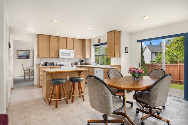 19021 113th Way SE, Renton, WA 98055 - dining room with healthy amount of natural light, recessed lighting, and light tile patterned floors