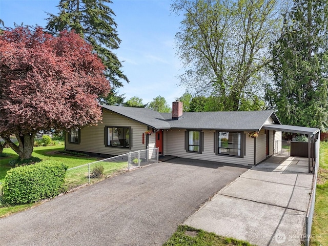 ranch-style house with asphalt driveway, a chimney, and an attached carport