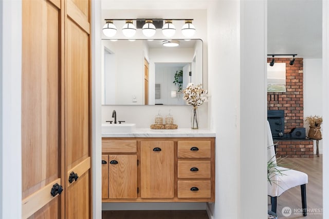 bathroom with vanity and wood finished floors