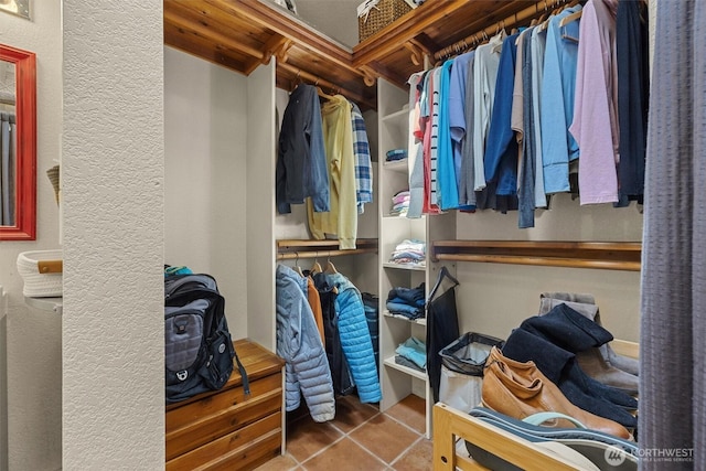 spacious closet featuring tile patterned floors
