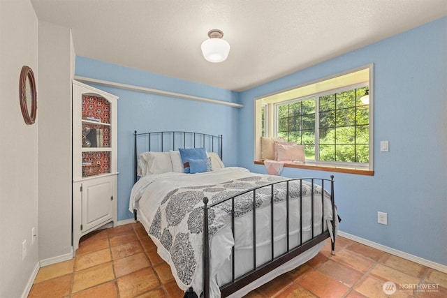 bedroom featuring baseboards