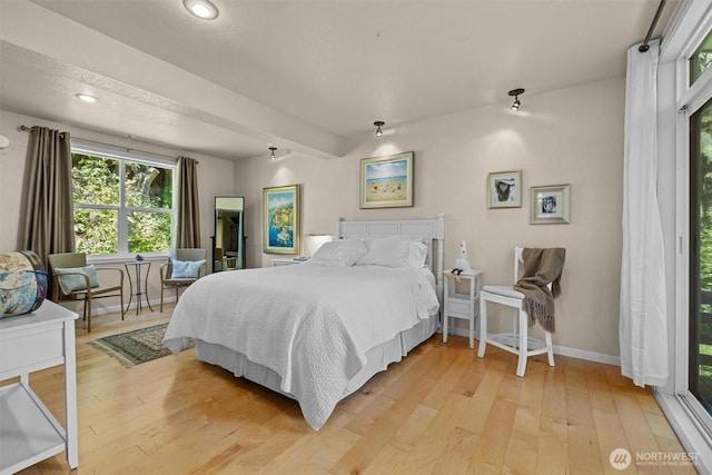 bedroom with light wood-style flooring, baseboards, and recessed lighting