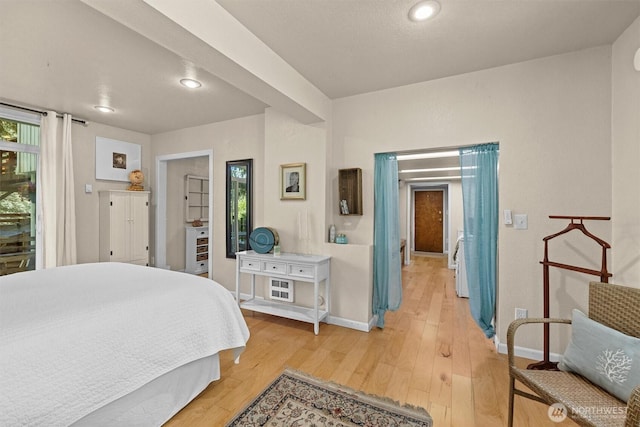 bedroom featuring baseboards, light wood-style floors, and recessed lighting