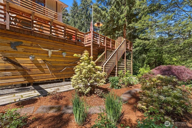 view of play area with a deck and stairs