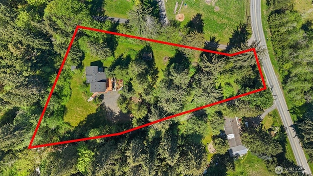 aerial view of property and surrounding area featuring property boundaries highlighted