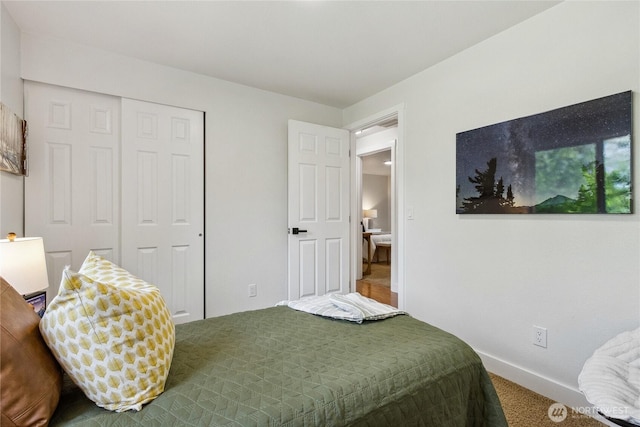 11707 NE 98th St, Kirkland, WA 98033 - bedroom featuring a closet, carpet, and baseboards