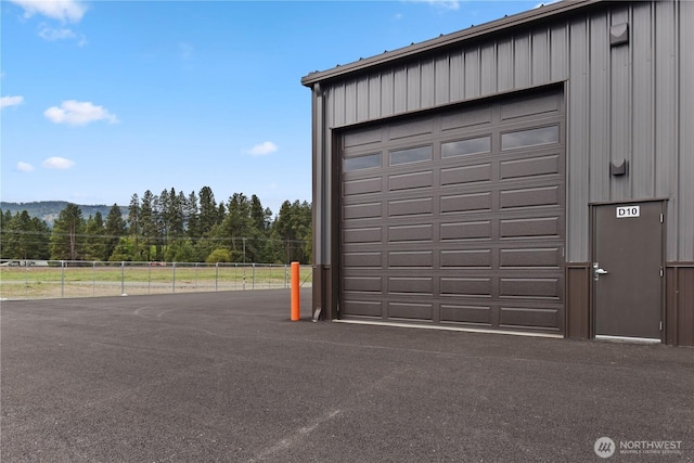 garage with fence