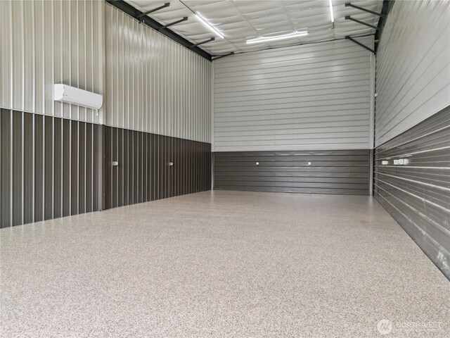 garage with an AC wall unit