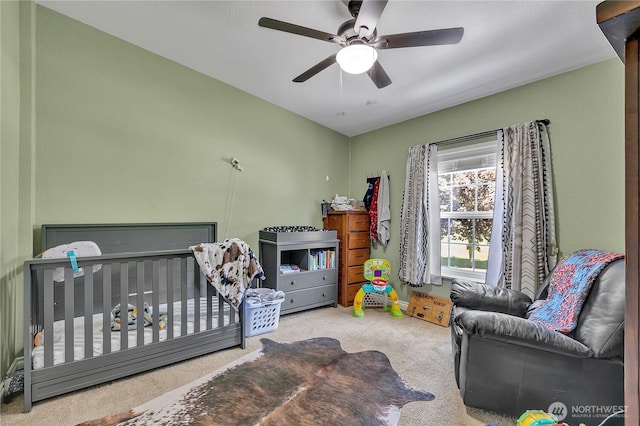 bedroom with ceiling fan and carpet