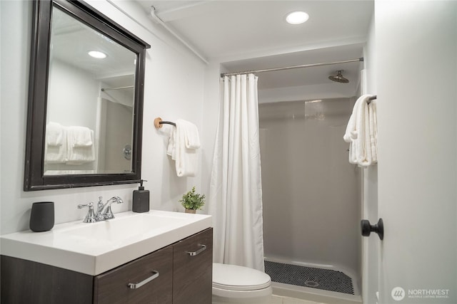 bathroom with vanity, visible vents, toilet, and a stall shower