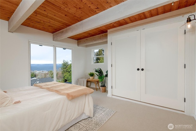 carpeted bedroom with multiple windows, wooden ceiling, and beam ceiling