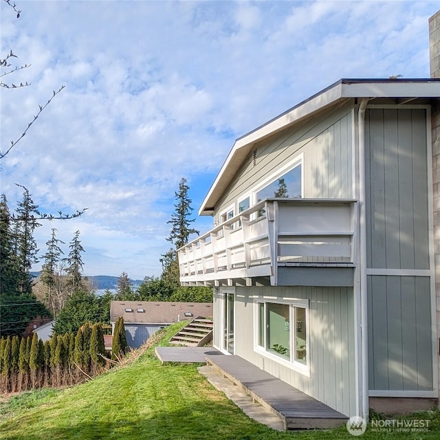 view of side of property with a deck