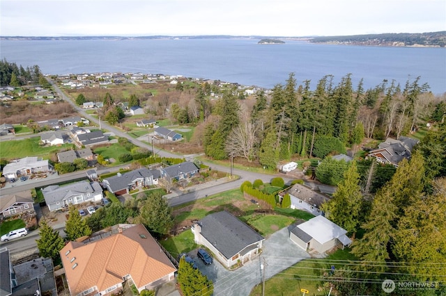 bird's eye view with a water view and a residential view