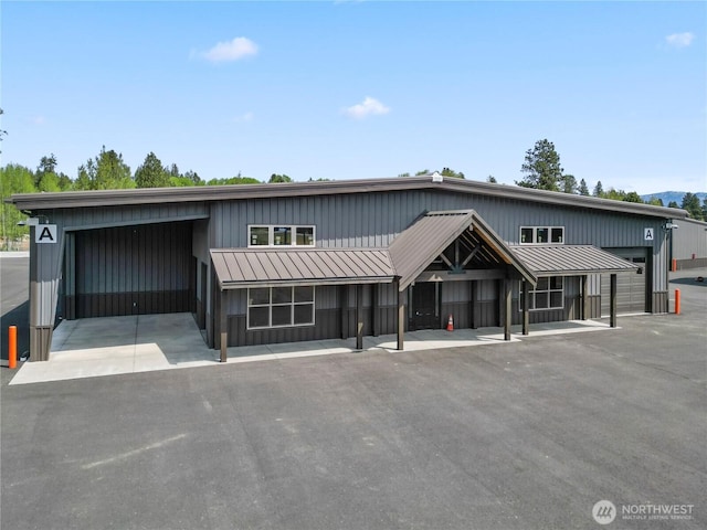townhome / multi-family property with metal roof and a standing seam roof