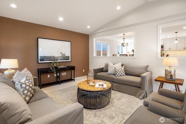 living room featuring vaulted ceiling, recessed lighting, a chandelier, baseboards, and light carpet