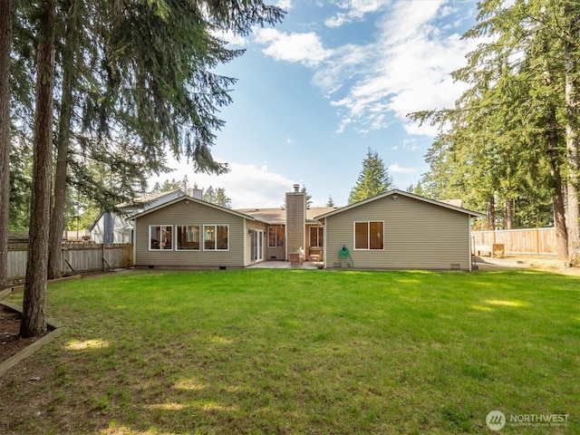back of house featuring crawl space, a patio area, and a chimney