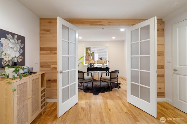 hallway with french doors, light wood finished floors, a desk, and recessed lighting