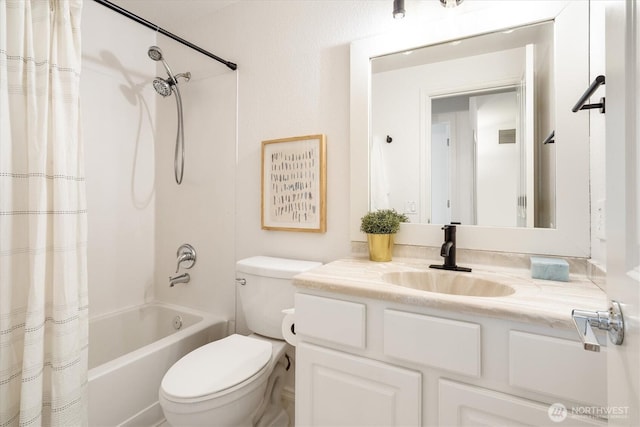 bathroom featuring shower / bathtub combination with curtain, toilet, and vanity
