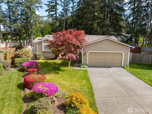 view of front facade with concrete driveway and an attached garage