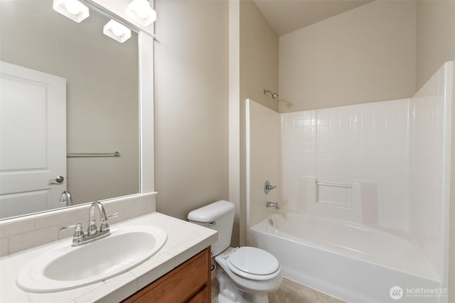full bathroom featuring vanity, toilet, and  shower combination