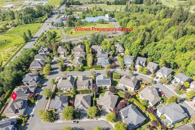 birds eye view of property with a residential view