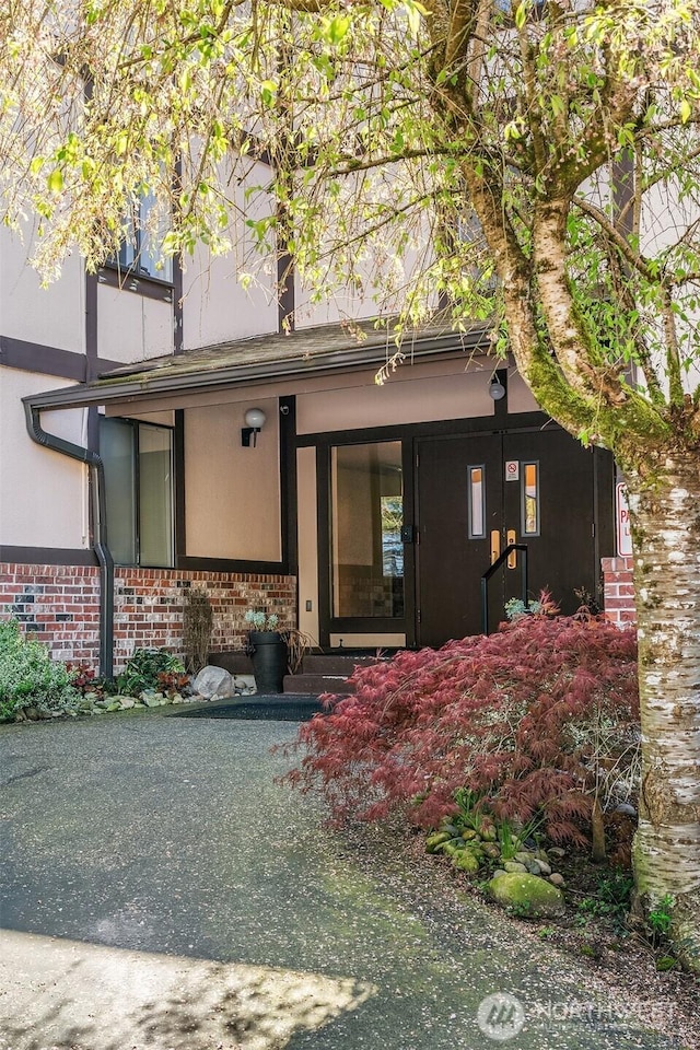 entrance to property with brick siding