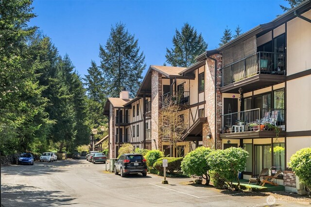 view of property with uncovered parking