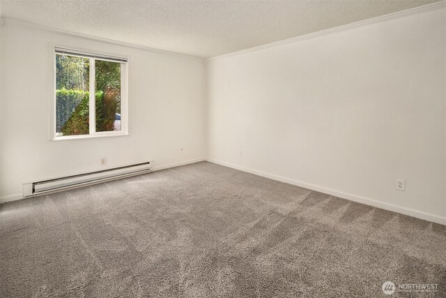 carpeted empty room with a baseboard radiator, a textured ceiling, ornamental molding, and baseboards
