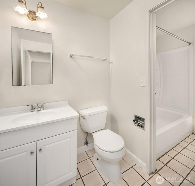 full bath with tile patterned floors, baseboards, toilet, vanity, and shower / washtub combination