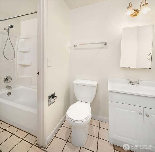 bathroom with tile patterned flooring, toilet, vanity, baseboards, and shower / bathtub combination
