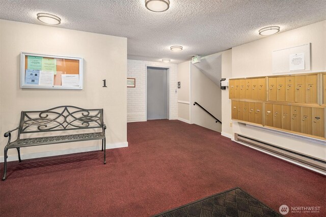 surrounding community with a textured ceiling and mail area