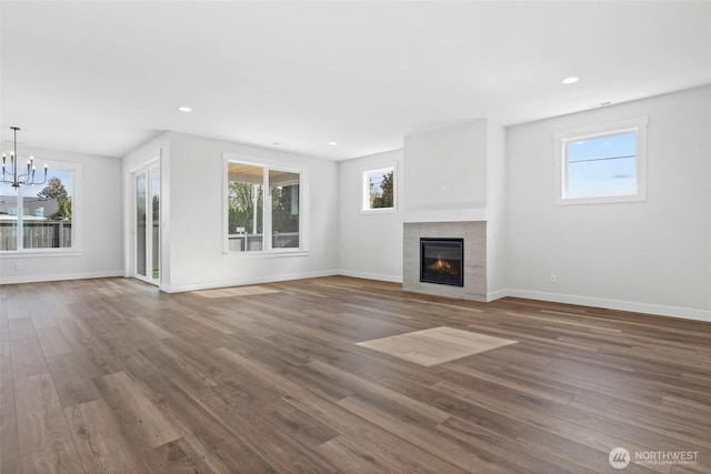 12507 40th Ave NW, Gig Harbor, WA 98332 - unfurnished living room with a healthy amount of sunlight and wood finished floors
