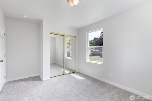 103 Madison St, Ryderwood, WA 98581 - unfurnished bedroom with carpet floors, a closet, and baseboards