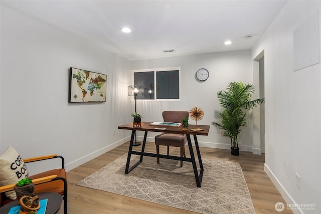 office featuring recessed lighting, baseboards, and light wood-type flooring