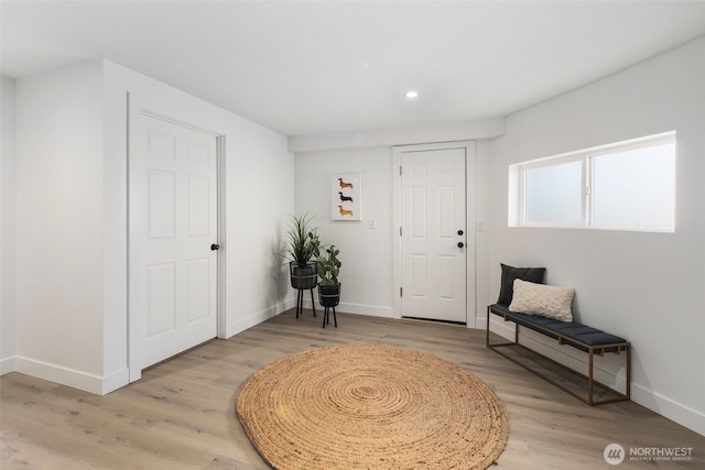 entrance foyer featuring recessed lighting, baseboards, and light wood finished floors