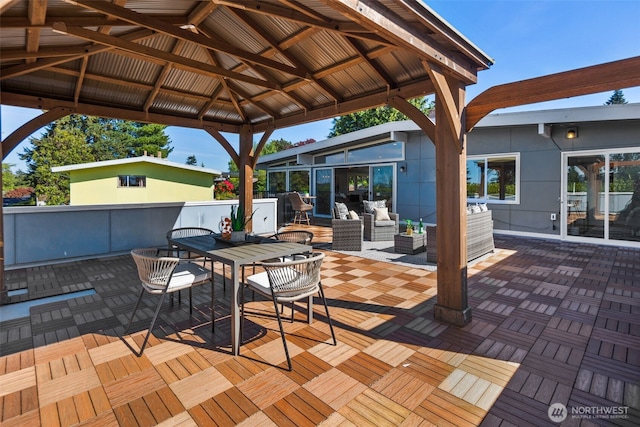 deck featuring a gazebo, an outdoor hangout area, outdoor dining area, and a patio area