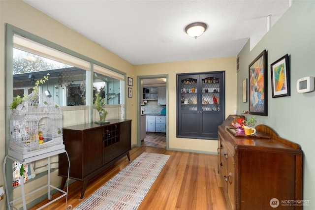 1203 Tower Ave, Raymond, WA 98577 - doorway to outside featuring wood finished floors