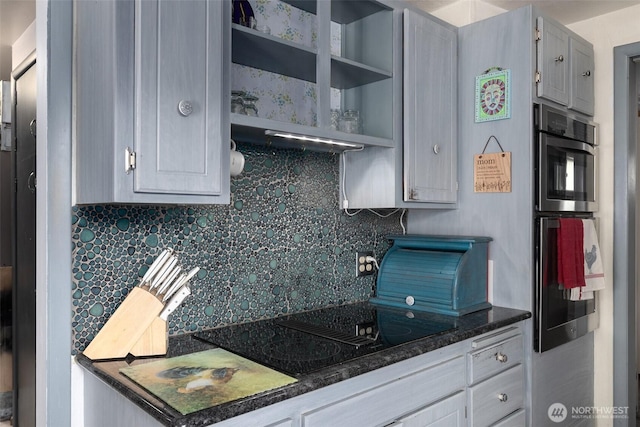1203 Tower Ave, Raymond, WA 98577 - kitchen with decorative backsplash, black electric cooktop, open shelves, and double oven