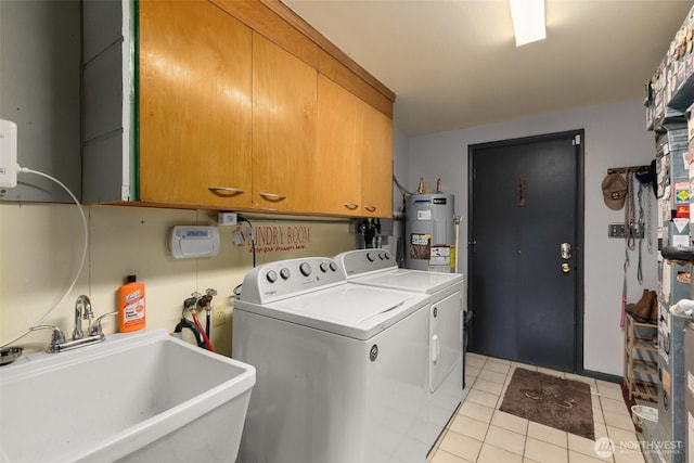 1203 Tower Ave, Raymond, WA 98577 - clothes washing area with water heater, cabinet space, separate washer and dryer, and light tile patterned floors
