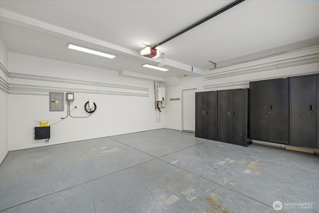 garage with a garage door opener and electric panel