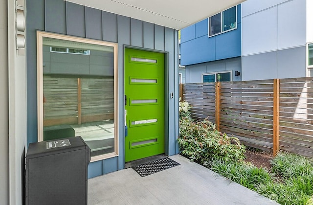 1709 NW 64th St, Seattle, WA 98107 - view of exterior entry featuring fence and board and batten siding