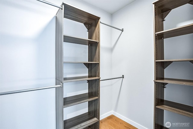 1709 NW 64th St, Seattle, WA 98107 - walk in closet featuring wood finished floors