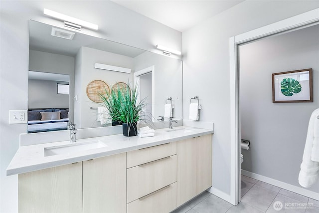 1709 NW 64th St, Seattle, WA 98107 - ensuite bathroom featuring toilet, tile patterned floors, double vanity, and baseboards