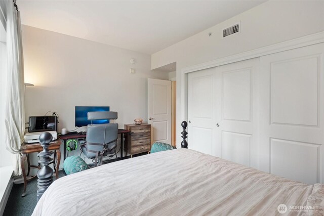 1920 4th Ave Unit 502, Seattle, WA 98101 - bedroom featuring a closet and carpet flooring