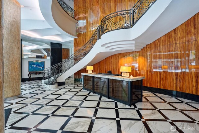 1920 4th Ave Unit 502, Seattle, WA 98101 - welcome area featuring stairs, wood walls, a community bar, and a high ceiling