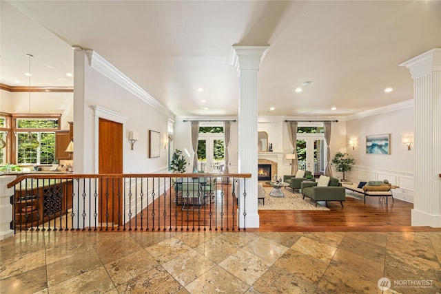 8380 SE 43rd St, Mercer Island, WA 98040 - interior space with crown molding, plenty of natural light, ornate columns, and stone tile floors