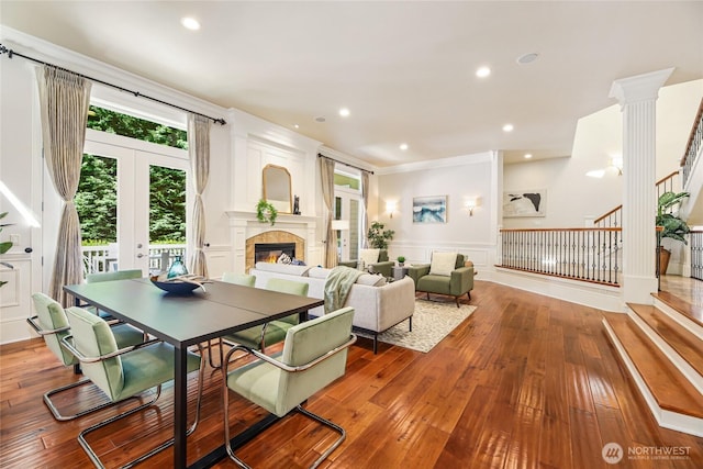 8380 SE 43rd St, Mercer Island, WA 98040 - dining area with a wainscoted wall, stairway, hardwood / wood-style flooring, a glass covered fireplace, and recessed lighting