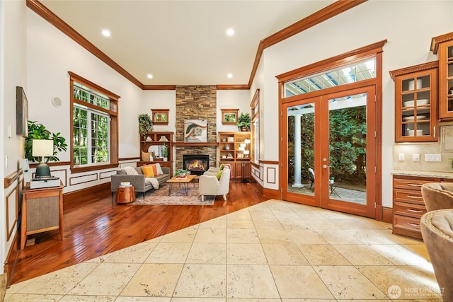 8380 SE 43rd St, Mercer Island, WA 98040 - living room featuring recessed lighting, baseboards, a stone fireplace, ornamental molding, and wood finished floors