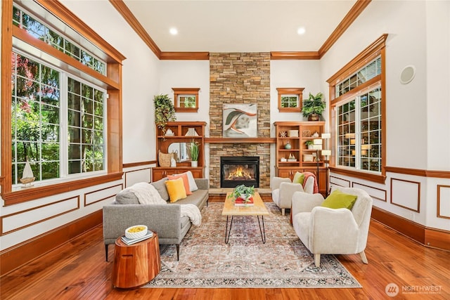 8380 SE 43rd St, Mercer Island, WA 98040 - sitting room featuring a fireplace, crown molding, hardwood / wood-style floors, and a wainscoted wall